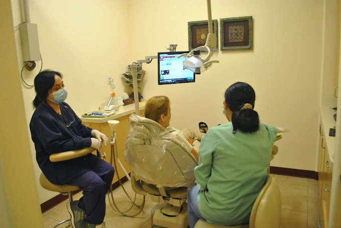Digital treatment room with patient chair and monitor